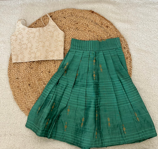 White top and green skirt