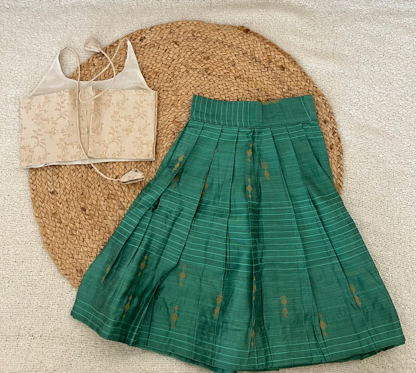 White top and green skirt