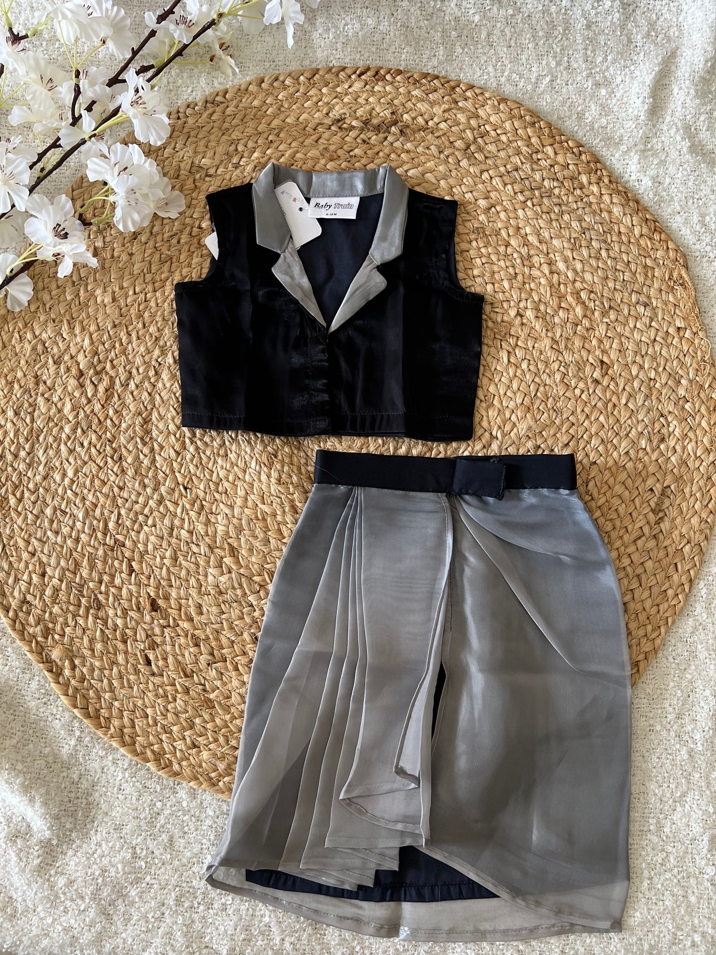 Black top and gray skirt