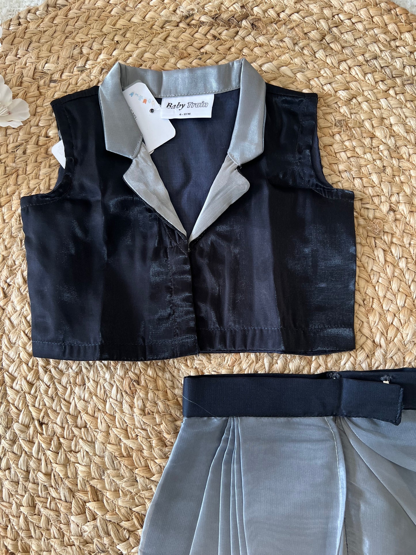 Black top and gray skirt