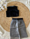 Black top and gray skirt