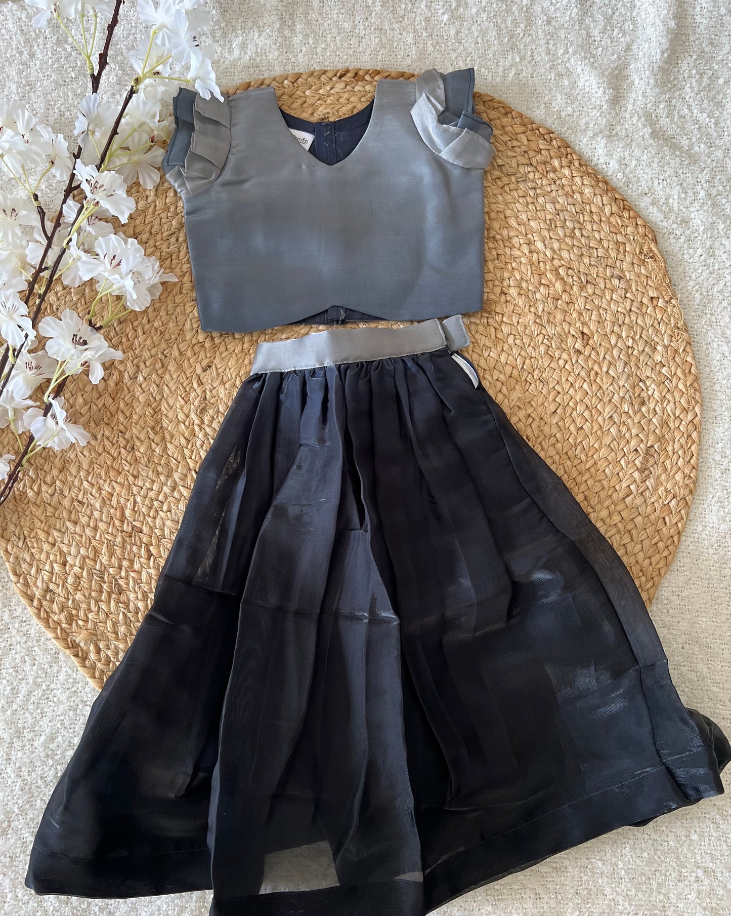 Gray top and black skirt