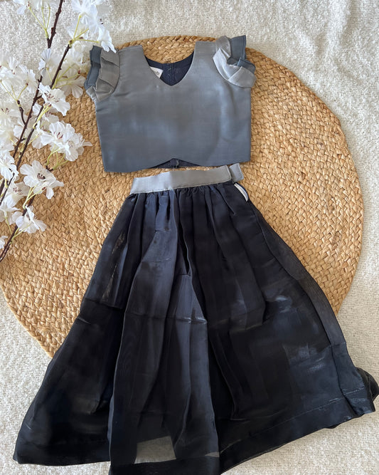 Gray top and black skirt