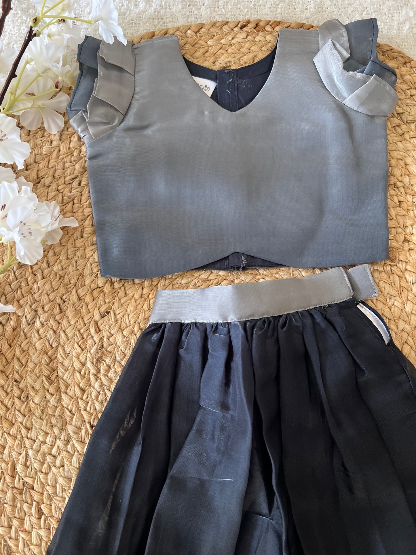 Gray top and black skirt