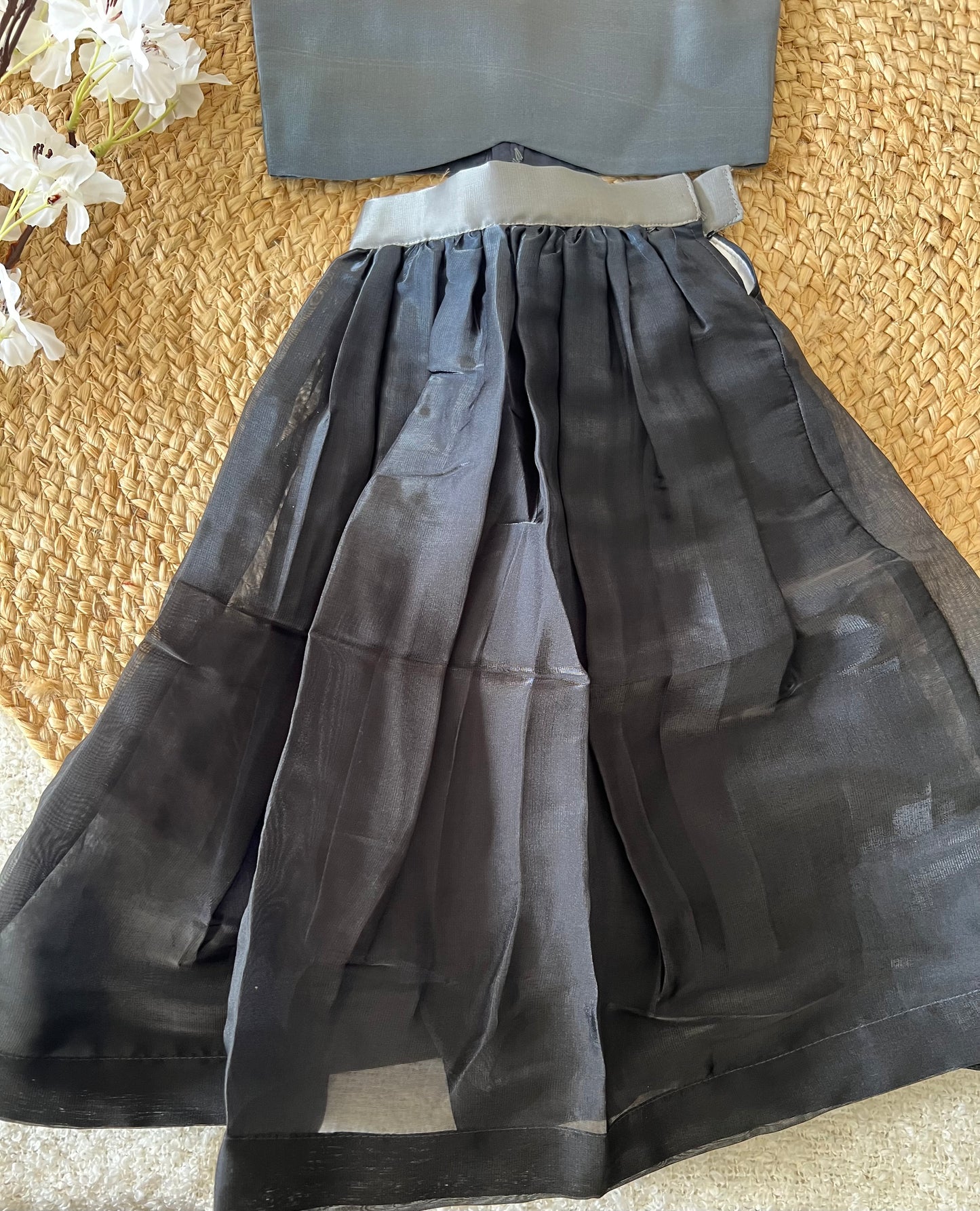 Gray top and black skirt