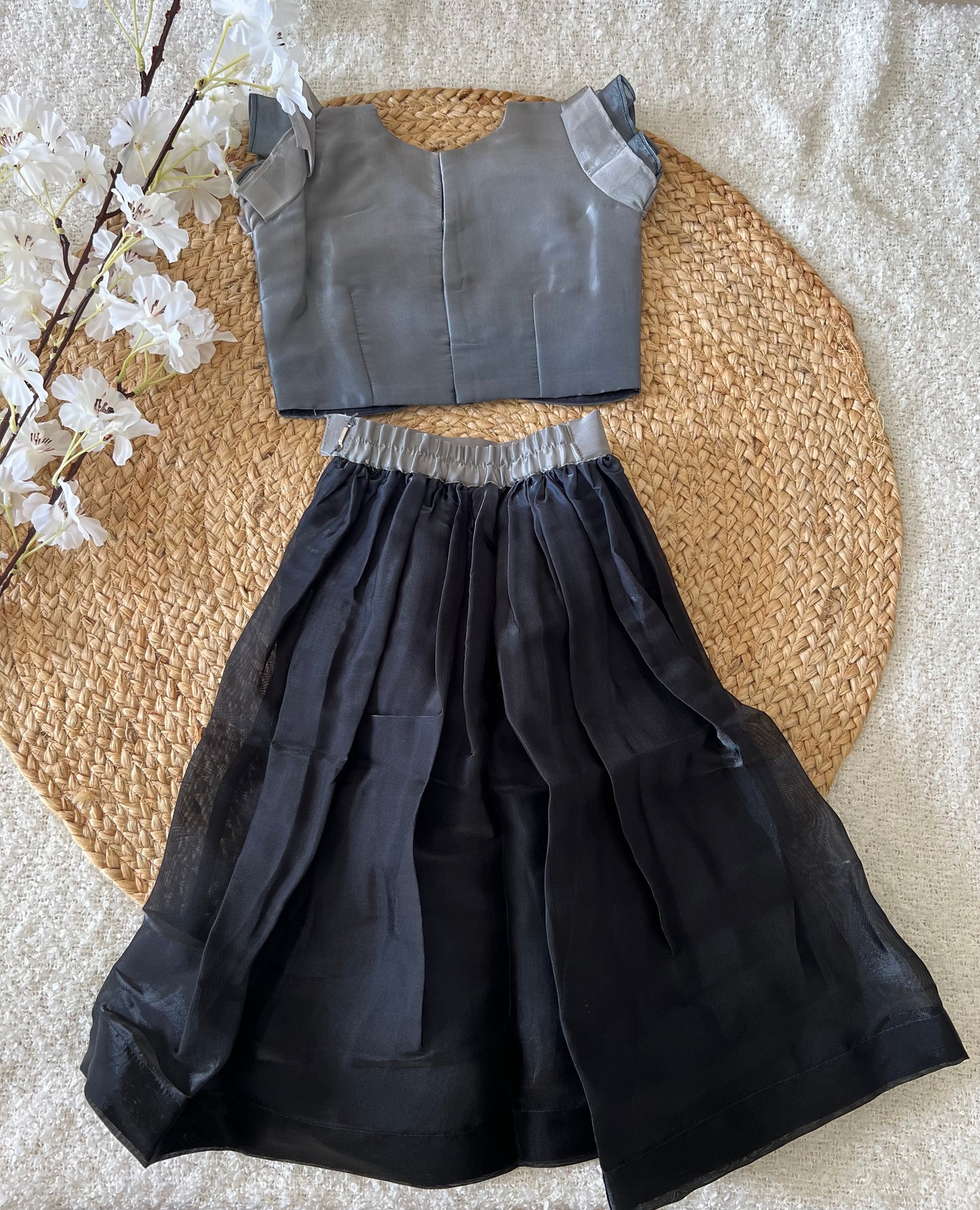 Gray top and black skirt