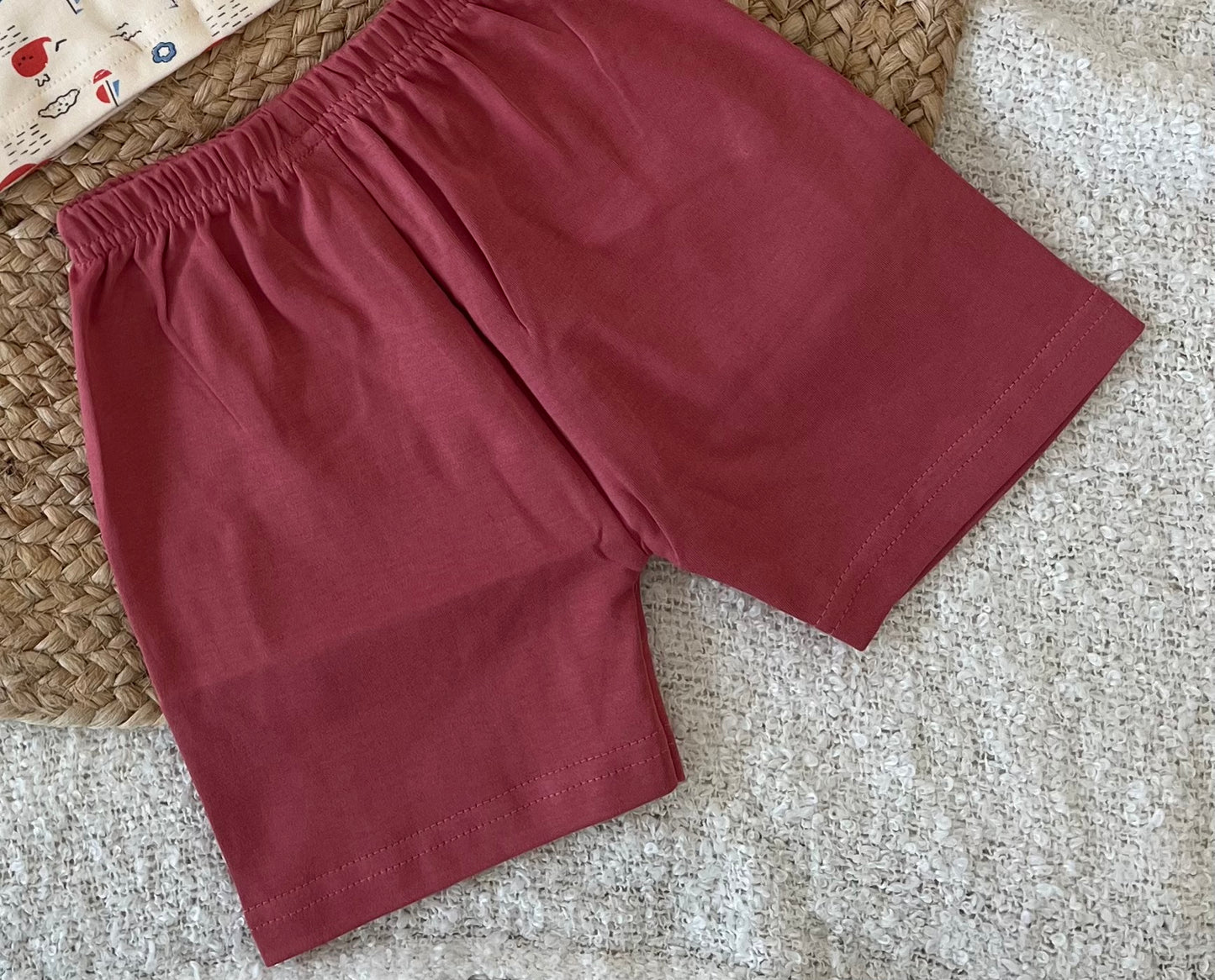 Beige T-shirt and red bottoms